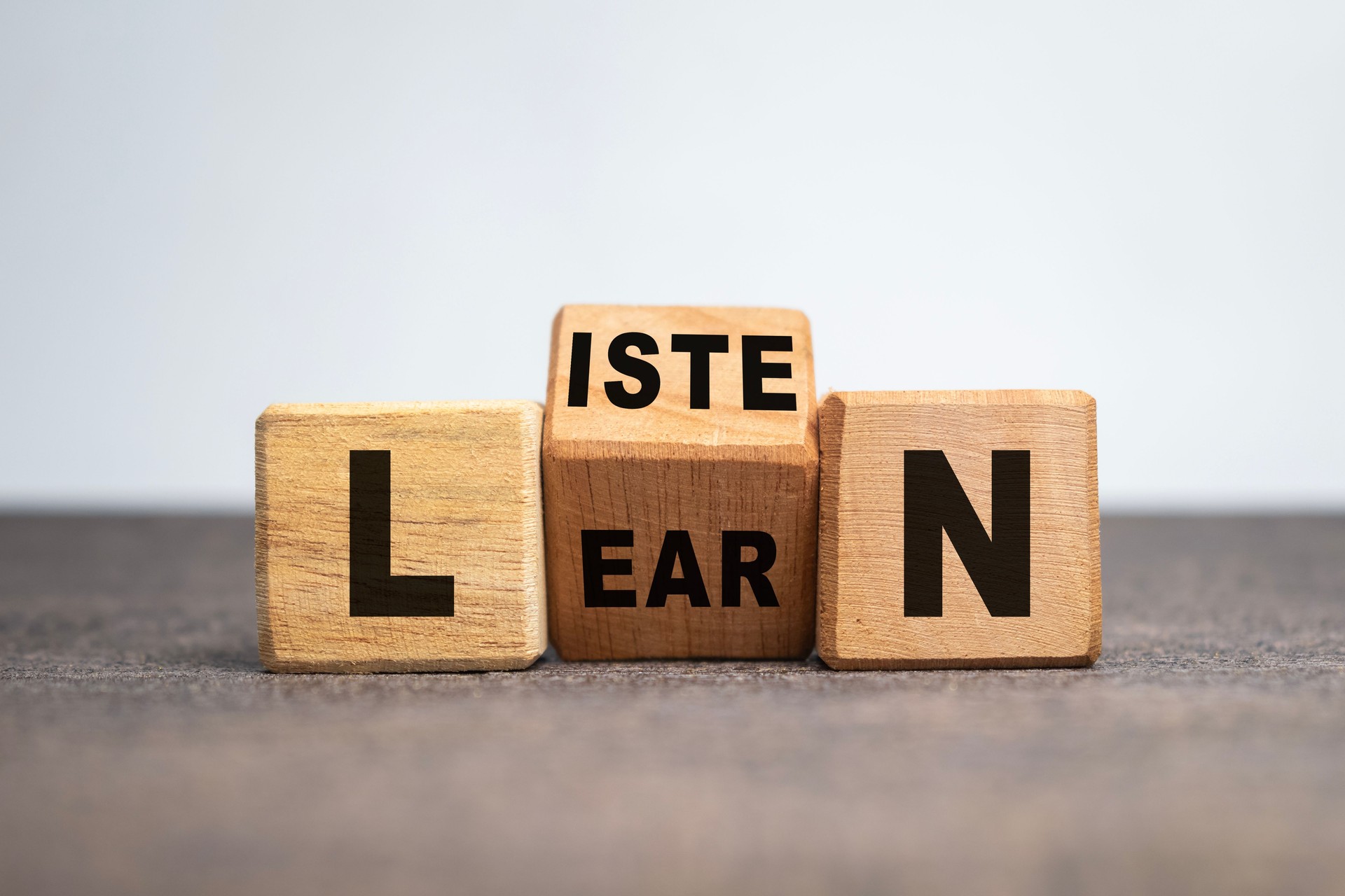 listen and learn words on turn wooden blocks isolated on white background